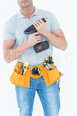 Technician holding handheld drill