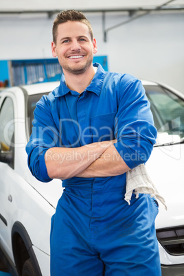 Mechanic smiling at the camera