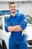 Mechanic smiling at the camera