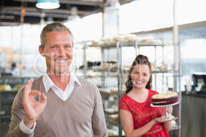 Cafe owners smiling at the camera