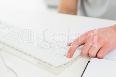 Hand of businessman typing on keyboard