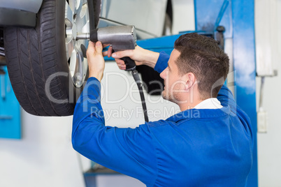 Mechanic adjusting the tire wheel