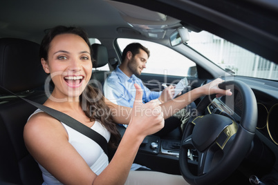 Young woman getting a driving lesson