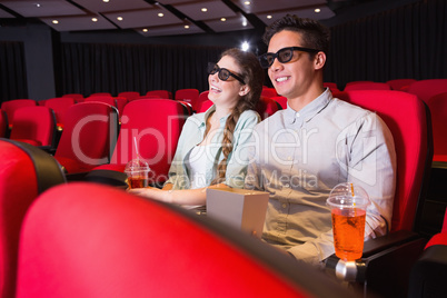 Young couple watching a 3d film