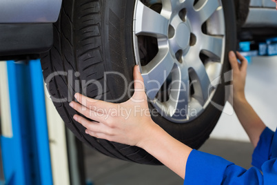 Mechanic adjusting the tire wheel