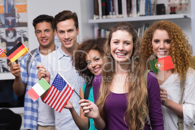 Happy students waving international flags