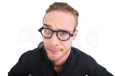 Doubtful businessman with glasses posing