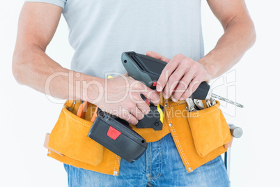 Repairman holding handheld drill