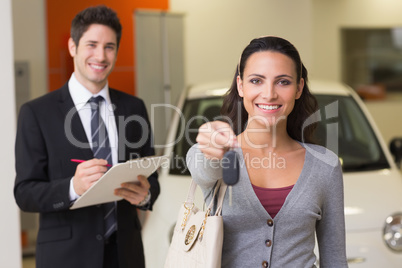 Happy customer holding a car key