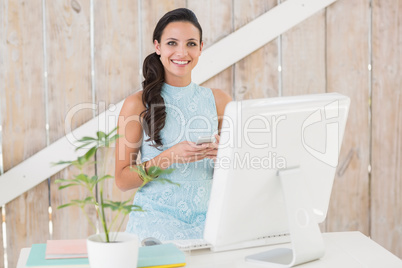 Stylish brunette working from home