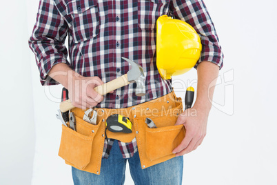 Repairman with hard hat and hammer Repairman with hard hat and hammer