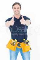 Man wearing tool belt while showing thumbs up sign