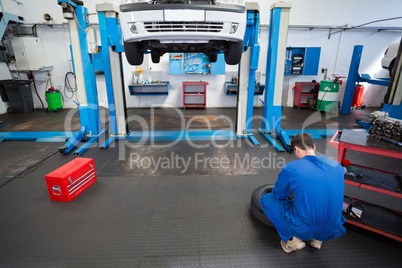 Mechanic working on a tire wheel