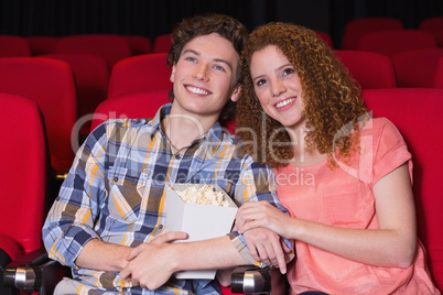 Young couple watching a film