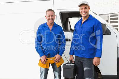 Smiling handymen looking at camera