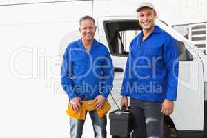 Smiling handymen looking at camera