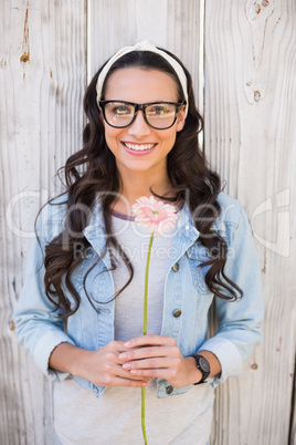 Pretty hipster holding a flower