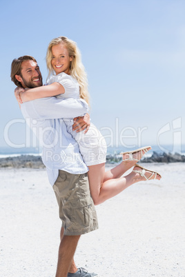 Cute couple hugging on the beach