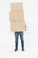 Courier man carrying cardboard boxes