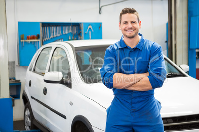 Mechanic smiling at the camera