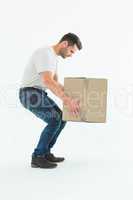 Courier man picking up cardboard box
