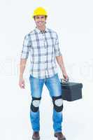 Male technician carrying tool box