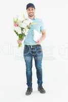 Happy flower delivery man holding clipboard