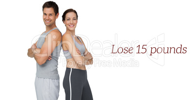 Portrait of a happy fit couple with hands crossed