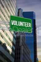 Volunteer against low angle view of skyscrapers