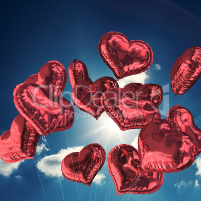 Composite image of heart balloons