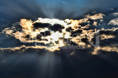 Stormy sky with a dramatic sunbeam