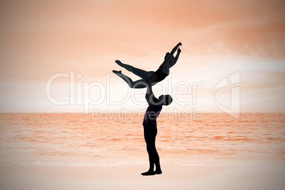 Composite image of ballet partners dancing gracefully together