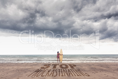 Composite image of calm woman in bikini with surfboard on beach