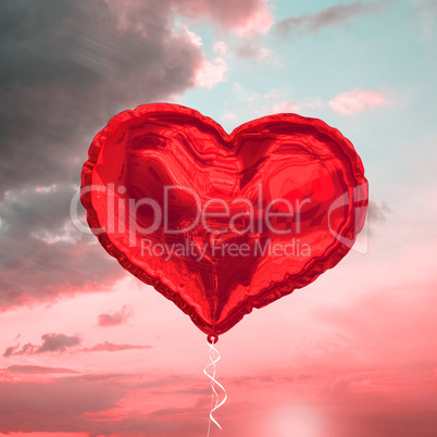 Composite image of red heart balloon