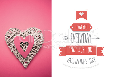 Composite image of wicker heart ornament with pink paper cut out