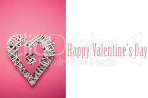 Composite image of wicker heart ornament with pink paper cut out