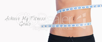 Fit belly surrounded by measuring tape