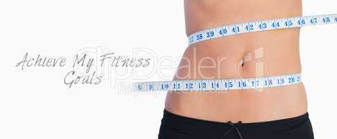 Fit belly surrounded by measuring tape