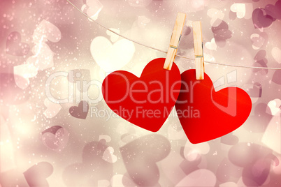 Composite image of hearts hanging on line Composite image of hearts hanging on line