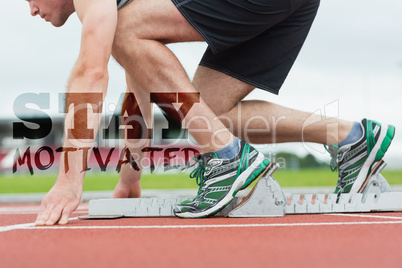 Composite image of side view of a man ready to race on running t