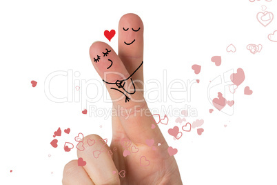 Composite image of fingers crossed like a couple