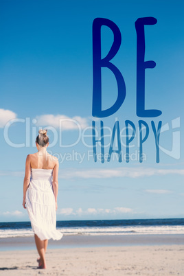 Composite image of blonde in white dress walking on the beach