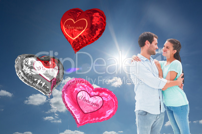 Composite image of attractive young couple hugging each other