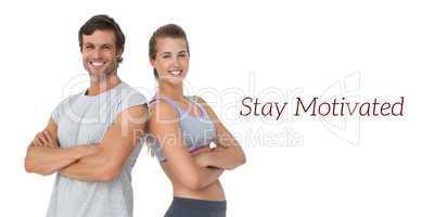 Portrait of a sporty young couple with arms crossed