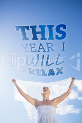 Composite image of pretty blonde in white dress holding up shawl