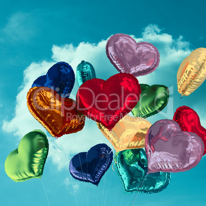 Composite image of heart balloons