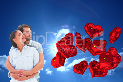 Composite image of cute couple embracing with eyes closed