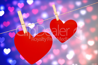Composite image of hearts hanging on a line Composite image of hearts hanging on a line