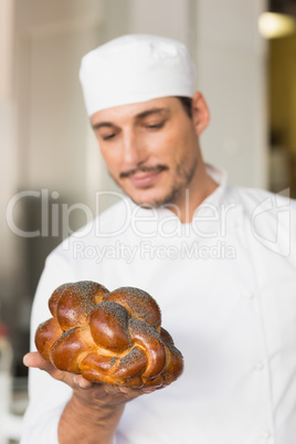 Baker checking freshly baked bread