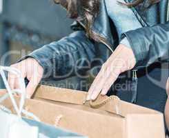 Shopping in city center. Woman legs and gift bags